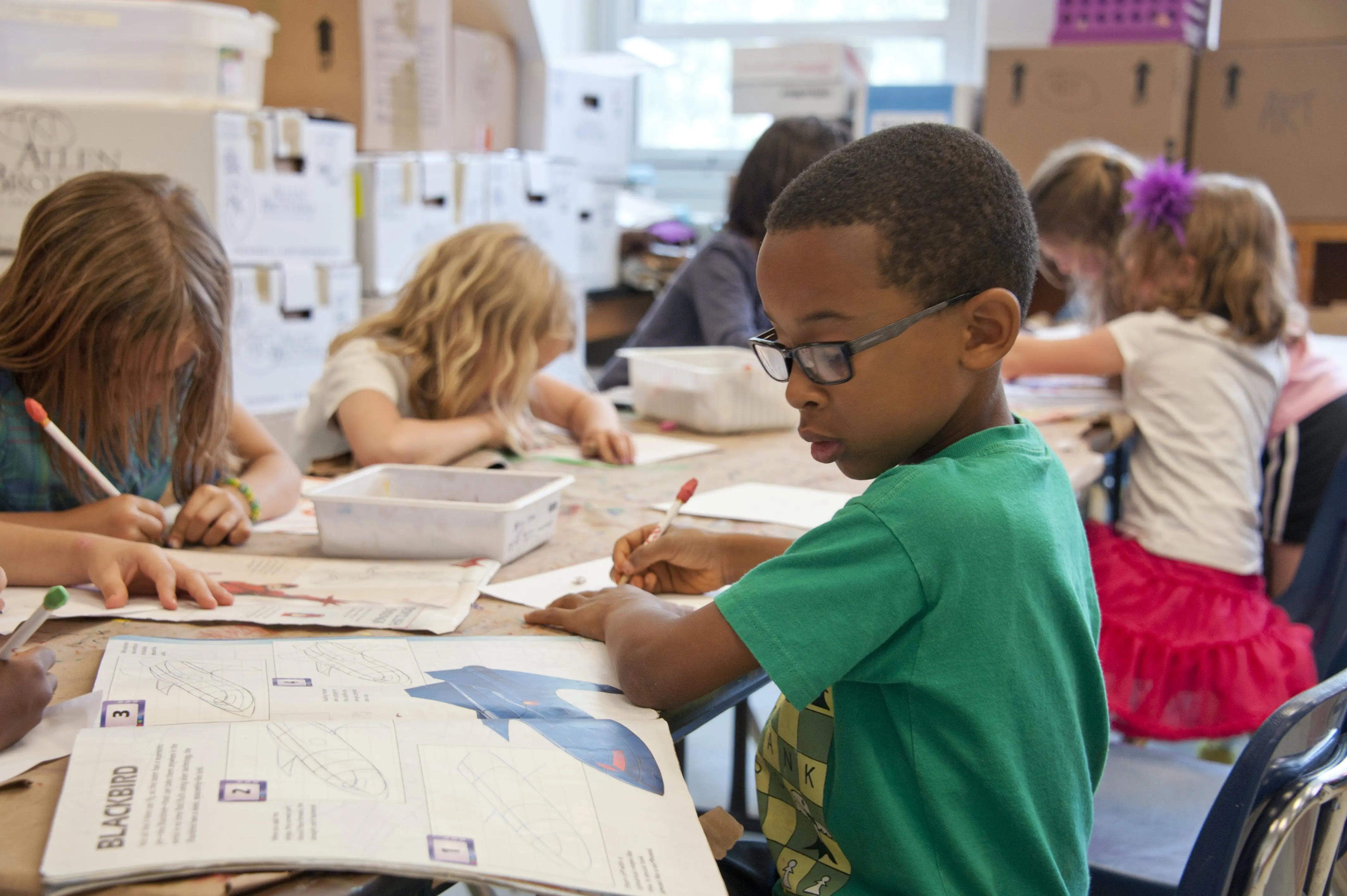 Young children studying in classroom